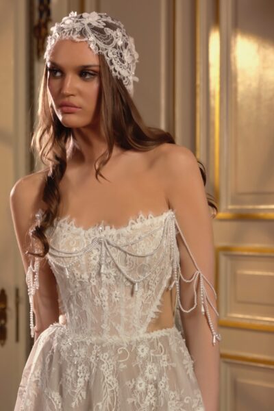 lace A-line wedding dress with cut-out waist and pearl draped straps