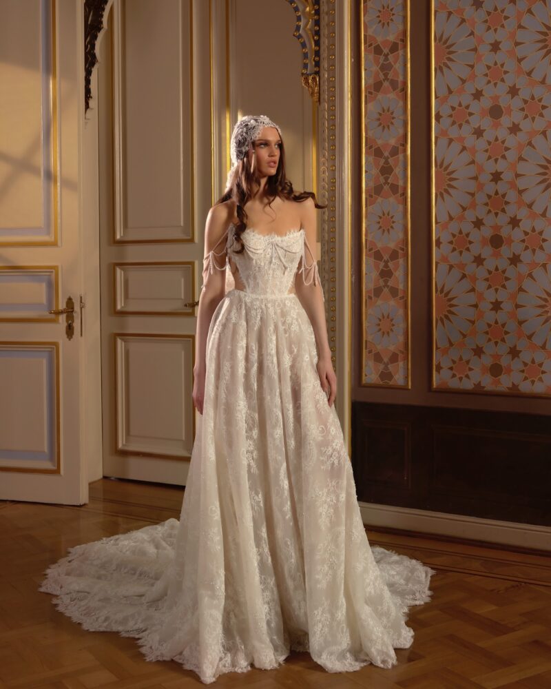 lace A-line wedding dress with pearl straps and cathedral train