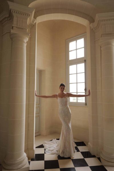 lace sheath wedding dress with low open back and chapel train