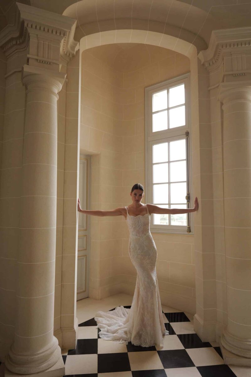 lace sheath wedding dress with low open back and chapel train