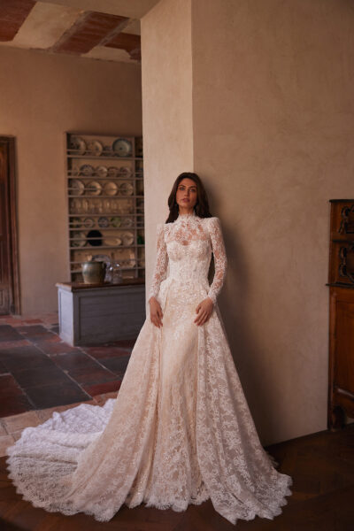 Lace sheath wedding dress with high neckline and full‑length sleeves