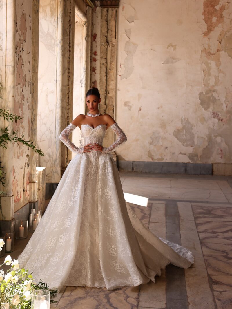 Lace ball gown wedding dress with off-shoulder neckline and long train