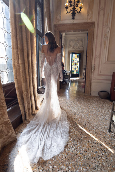 Illusion lace back on off shoulder wedding gown with long train
