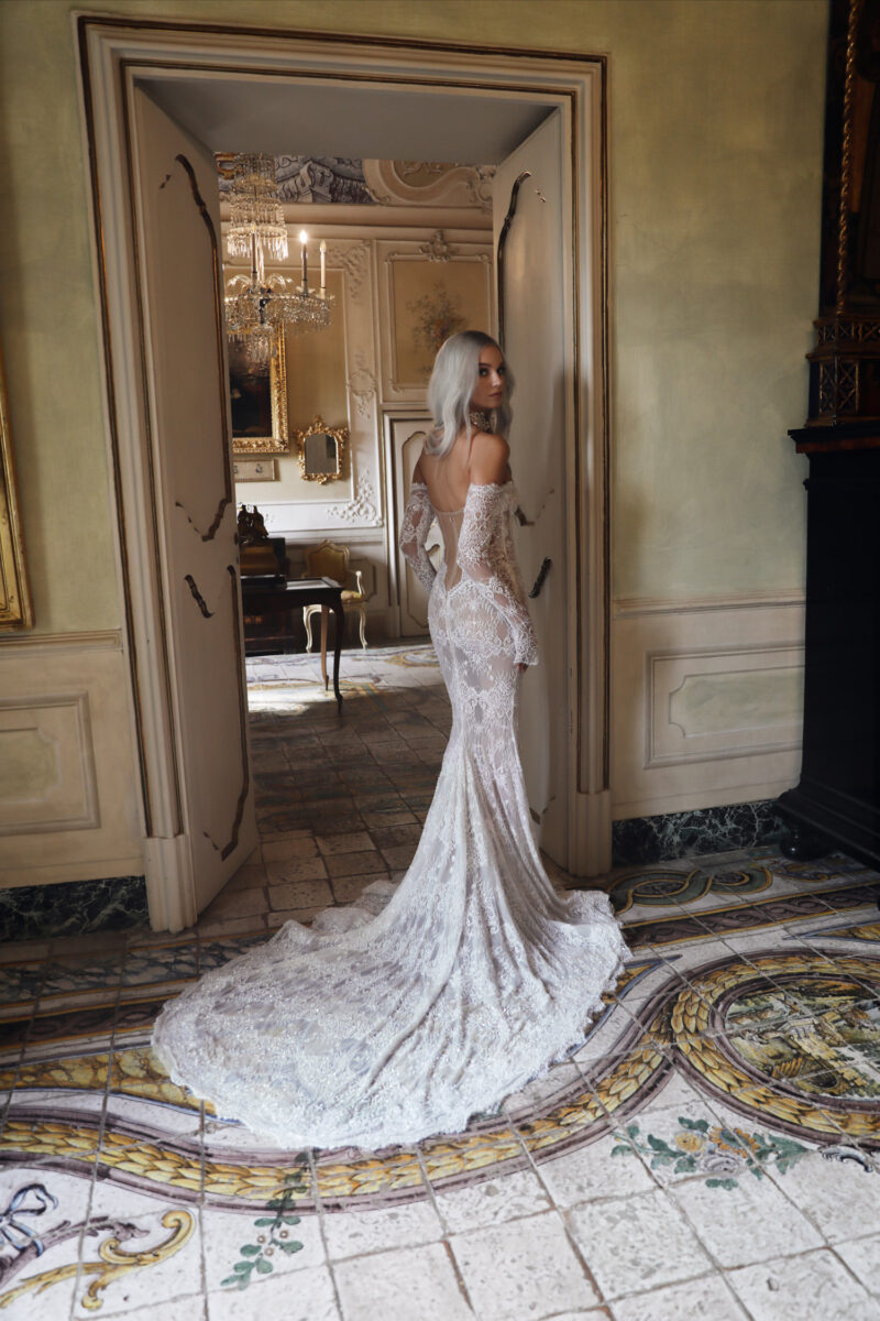 Open back off-shoulder wedding gown with long train