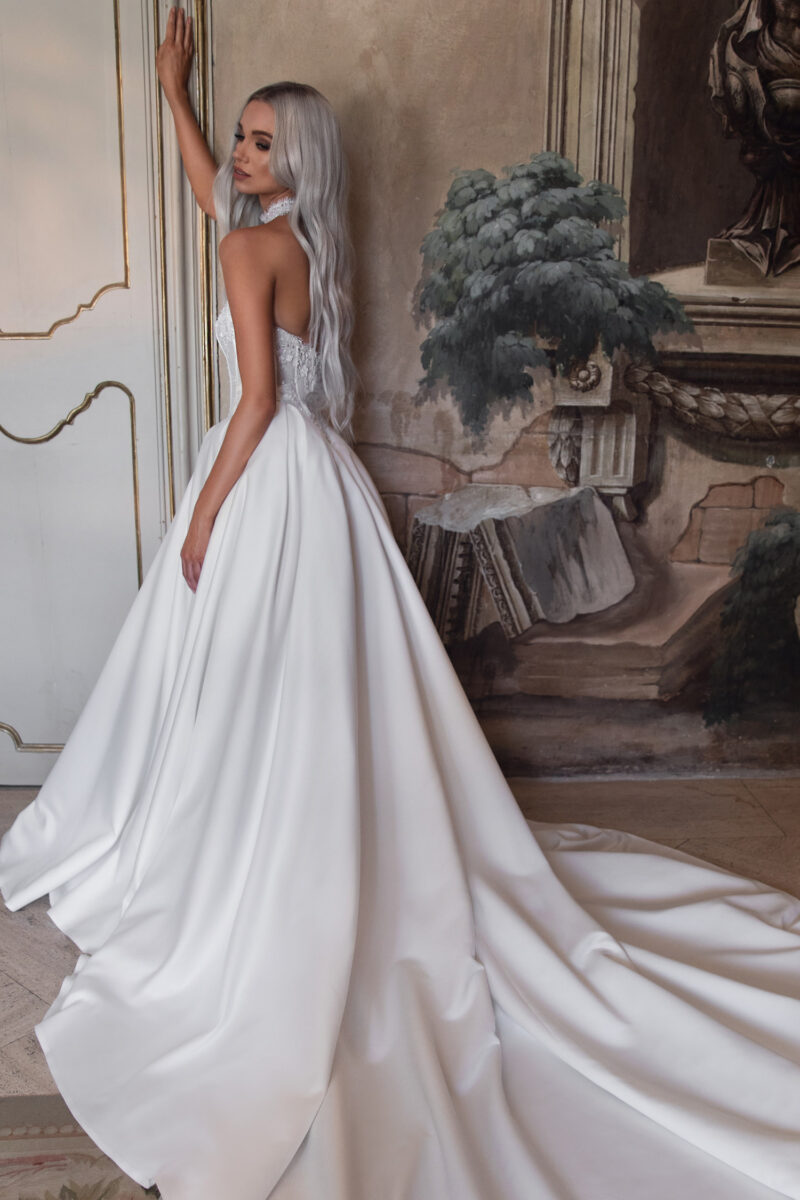 Back view of satin wedding dress with cathedral train